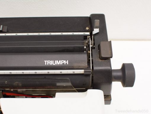 Vintage Triumph typewriter: classic charm, polished black finish, ideal for collectors and writers.