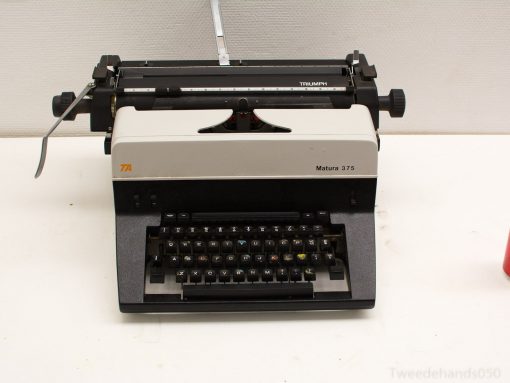 Vintage Triumph Matura 375 typewriter: elegant black-and-white design for nostalgic writers.