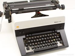 Vintage Triumph Matura 375 typewriter in classic white and black, perfect for nostalgic writers.