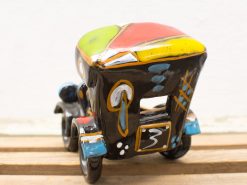 Vibrant ceramic jeepney replica showcasing Philippine culture with colorful geometric designs.