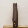 Elegant vintage wooden metronome with silver pendulum, perfect for musicians and collectors.