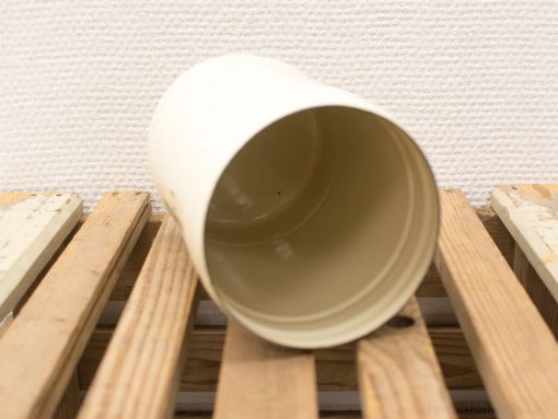 Elegant cream-colored cylindrical storage container, perfect for versatile home organization and decor.