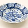 Elegant blue and white ceramic bowl with floral patterns, ideal for decor and collection.