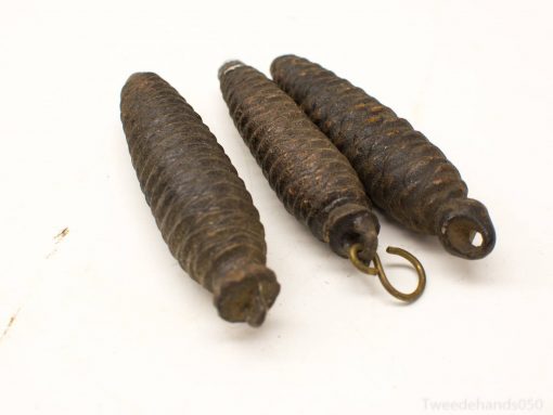 Antique metal hooks and weights, perfect for decorative accents with rich historical significance.