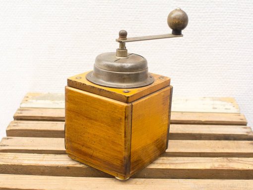 Classic wooden coffee grinder with vintage metal mechanism, perfect for coffee enthusiasts and decor.