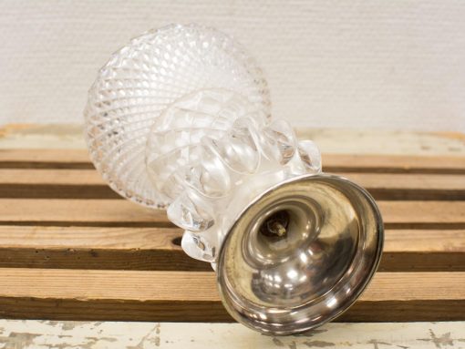 Elegant vintage glass candleholder with a polished metal base for stylish home decor.