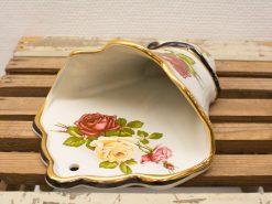 Elegant porcelain shell planter featuring hand-painted roses and luxurious gold trim.