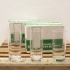 Elegant long drink glasses on rustic wood, perfect for gatherings and social occasions.