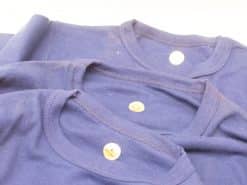 High-quality navy blue T-shirts with round necklines and metallic buttons for versatile casual wear.