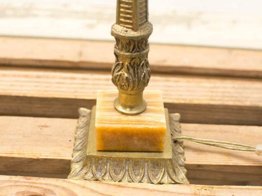 Elegant amber table lamp with brass accents, perfect for adding luxury to any space.