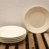 Elegant creamy white ceramic plates set for stylish dining and everyday use.