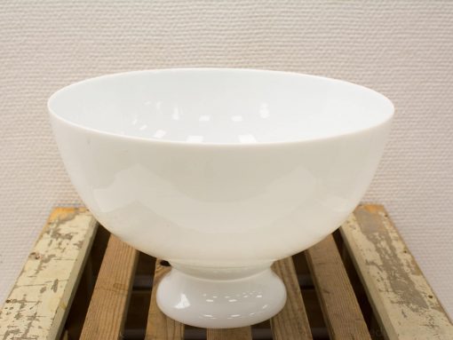 Minimalist white bowl on wood stand, perfect for serving and enhancing table decor.
