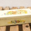 Vintage yellow tin box with horse-drawn carriage illustrations, perfect for collectors and décor.