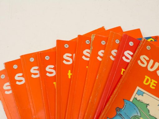 Vintage Suske en Wiske comic collection, issues 111-273, featuring vibrant orange covers.