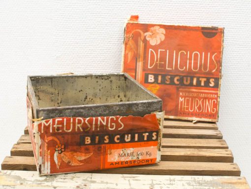 Vintage Meursing biscuit tin and box showcase nostalgic charm and decorative artistry.