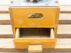 Vintage wooden coffee grinder with glass bowl, ideal for fresh-ground coffee enthusiasts.
