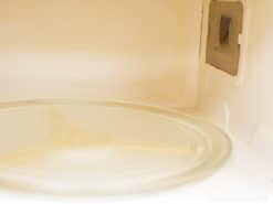 Clean and modern Sharp microwave interior with a glass turntable, perfect for any kitchen.
