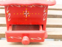 Charming hand-painted red decorative box with floral motifs and a functional drawer.