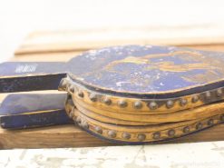 Antique blue wooden clogs with gold embellishments, showcasing craftsmanship and character. Perfect for collectors.