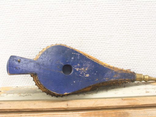 Antique blue bellows with leather edges, showcasing classic craftsmanship and decorative appeal.