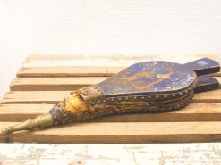 Vintage blue and gold bellows, an elegant tool showcasing artisanal craftsmanship and historical charm.