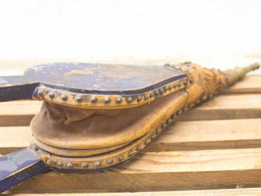 Vintage blue leather bellows with patina for fire stoking or rustic home decor.