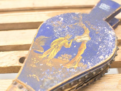 Antique wooden bellows with vibrant artwork and intricate natural designs, perfect for vintage collectors.