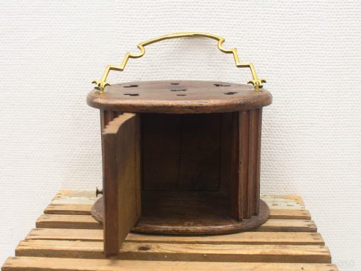 Charming vintage wooden container with brass handle, perfect for storage and rustic decor.