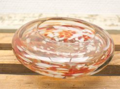 Colorful glass dish showcasing elegant design and artistic craftsmanship, perfect for decor or storage.