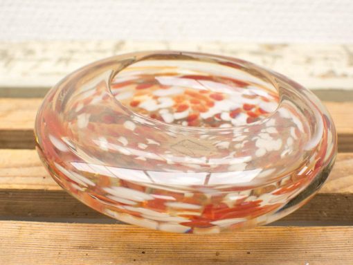 Colorful glass dish showcasing elegant design and artistic craftsmanship, perfect for decor or storage.