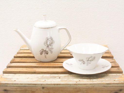 Elegant vintage tea set with rose motifs, perfect for afternoon gatherings and cozy moments.