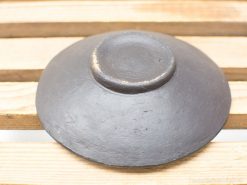 Elegant handcrafted black ceramic bowl, perfect for decor or everyday use.