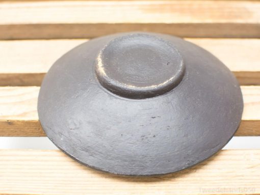 Elegant handcrafted black ceramic bowl, perfect for decor or everyday use.