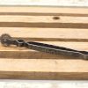 Vintage tool with serrated wheel, aged patina, perfect for craftsmanship and collectors.