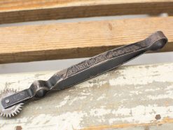 Vintage pastry wheel by Schelleken, perfect for creating decorative edges on baked goods.