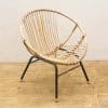 Modern bohemian bamboo chair with metal frame, ideal for stylish living spaces and reading nooks.