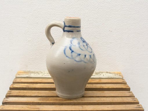Elegant gray ceramic jug with blue floral design, perfect for décor or functional use.