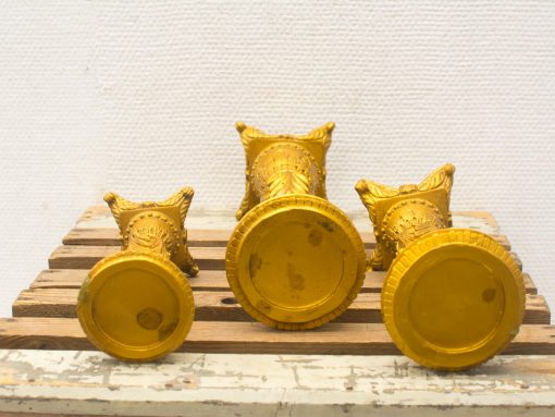 Elegant golden decorative objects set for stylish home décor and chic tabletop displays.