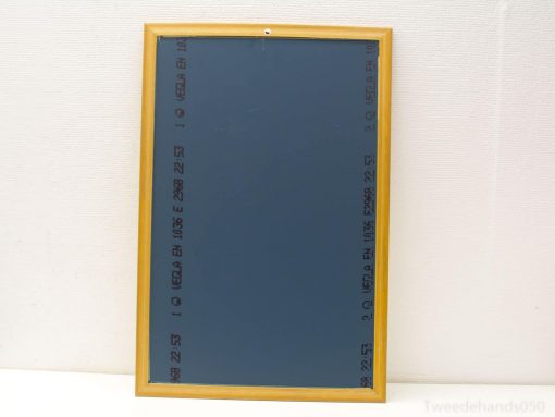 Stylish blue bulletin board with light wood frame, perfect for notes and photos.