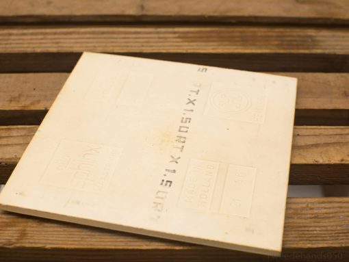 Vintage ceramic scale tile with embossed design, adding charm and history to your decor.