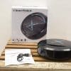 Efficient CleanRobot vacuum with sleek design, USB charger, and user manual for easy cleaning.