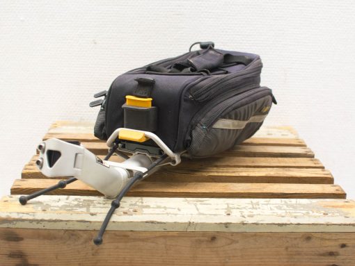 Durable travel bag with tripod support, perfect for outdoor adventures and photography gear.
