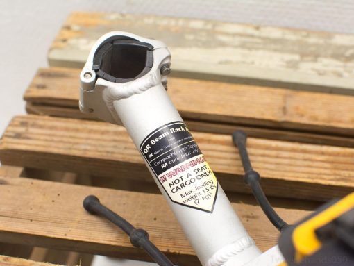 Lightweight QR beam rack for bikes; safe cargo support up to 15 lbs.