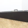 Sleek black instrument case for guitars and violins, designed for durability and transport.