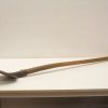 Vintage gardening hoe with sturdy wooden handle and metal blade, perfect for cultivating soil.