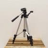 Lightweight aluminum tripod with quick-release plate, ideal for photographers seeking stability and versatility.