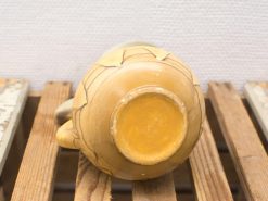 Authentic vintage pottery vase with unique motifs and earthy tones, perfect for decoration.