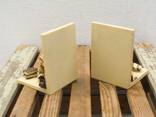 Charming cream bookends with miniature details, perfect for stylishly organizing your bookshelf.