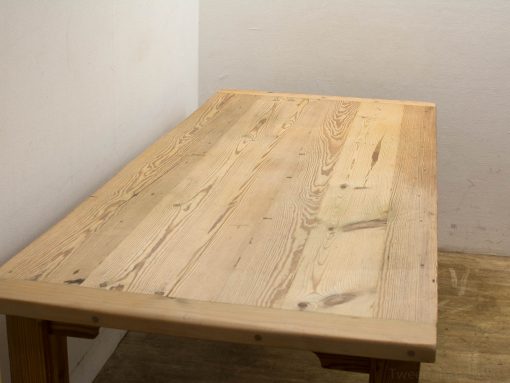 Rustic light-colored wooden table, perfect for minimalistic spaces, blending beauty with functionality.