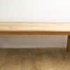 Rustic wooden table with natural finish, perfect for gatherings and stylish workspaces.